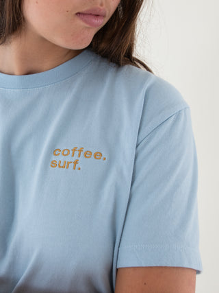 Coffee. Surf. Organic Cotton T-Shirt in baby blue color