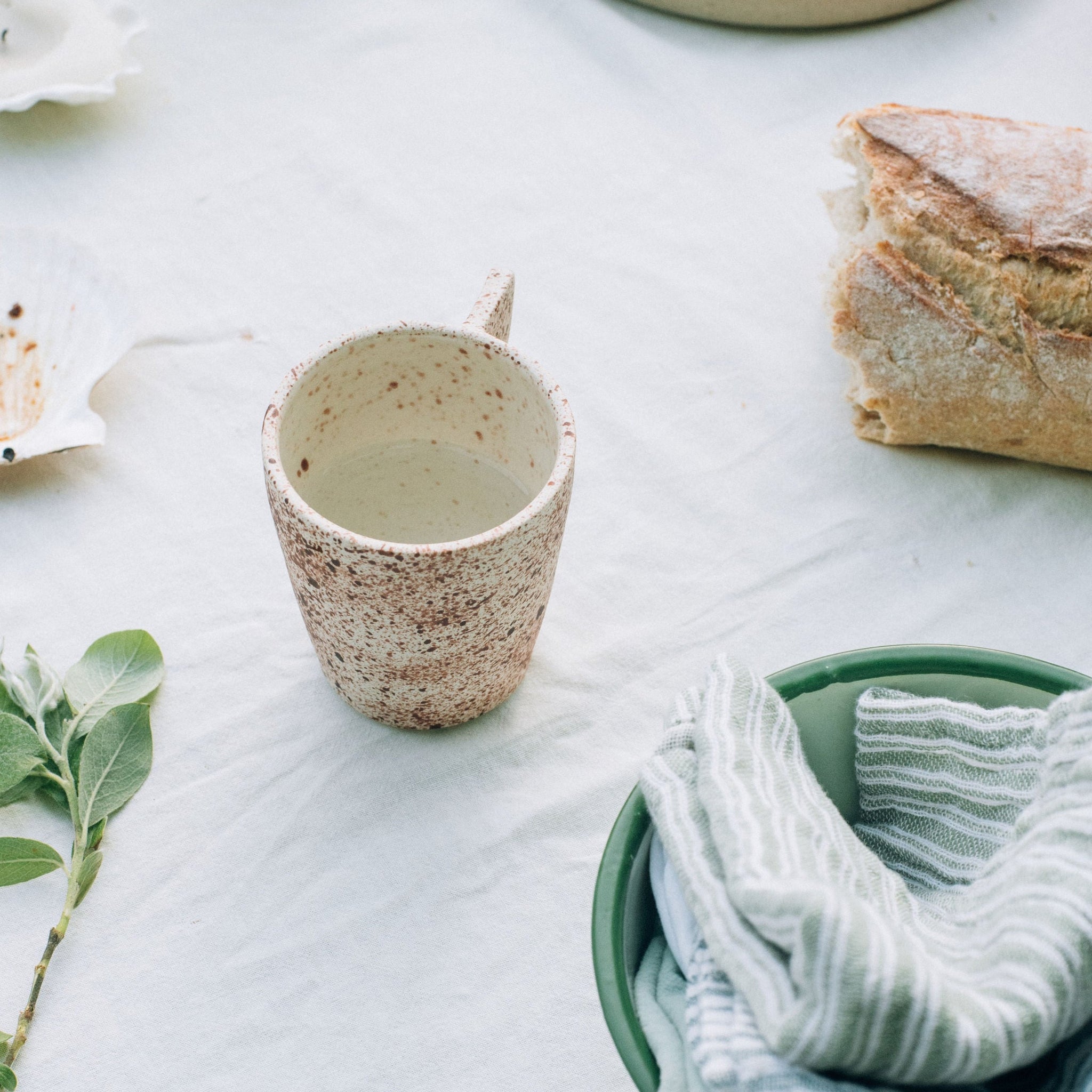 Ceramic Mug | speckled | on hip, french style table