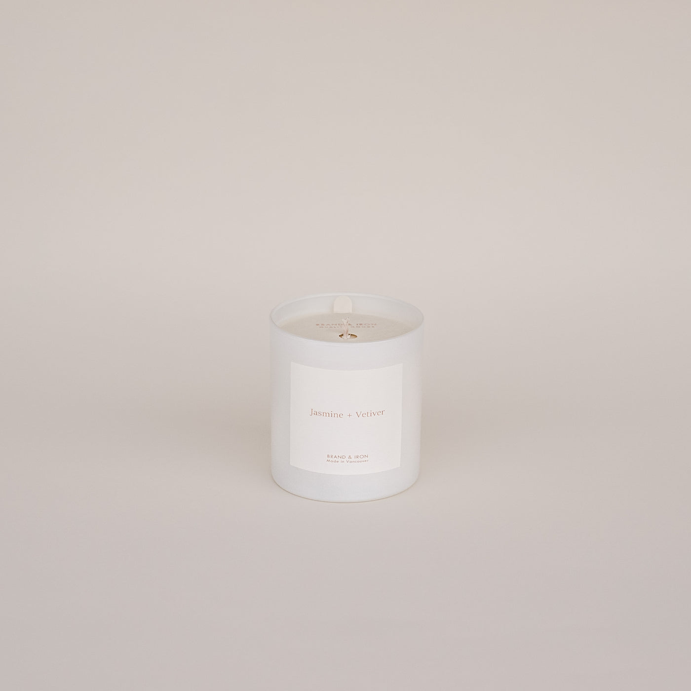 The Jasmine and Vetiver candle by Brand & Iron pictured against a white background. 